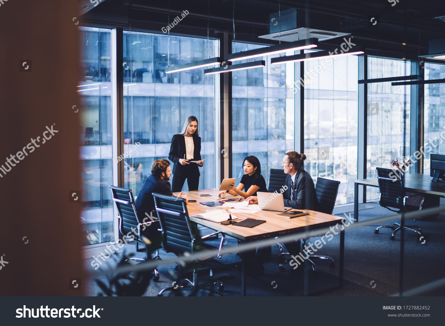stock-photo-from-above-of-group-of-diverse-colleagues-in-formal-clothing-discussing-business-ideas-while-1727882452